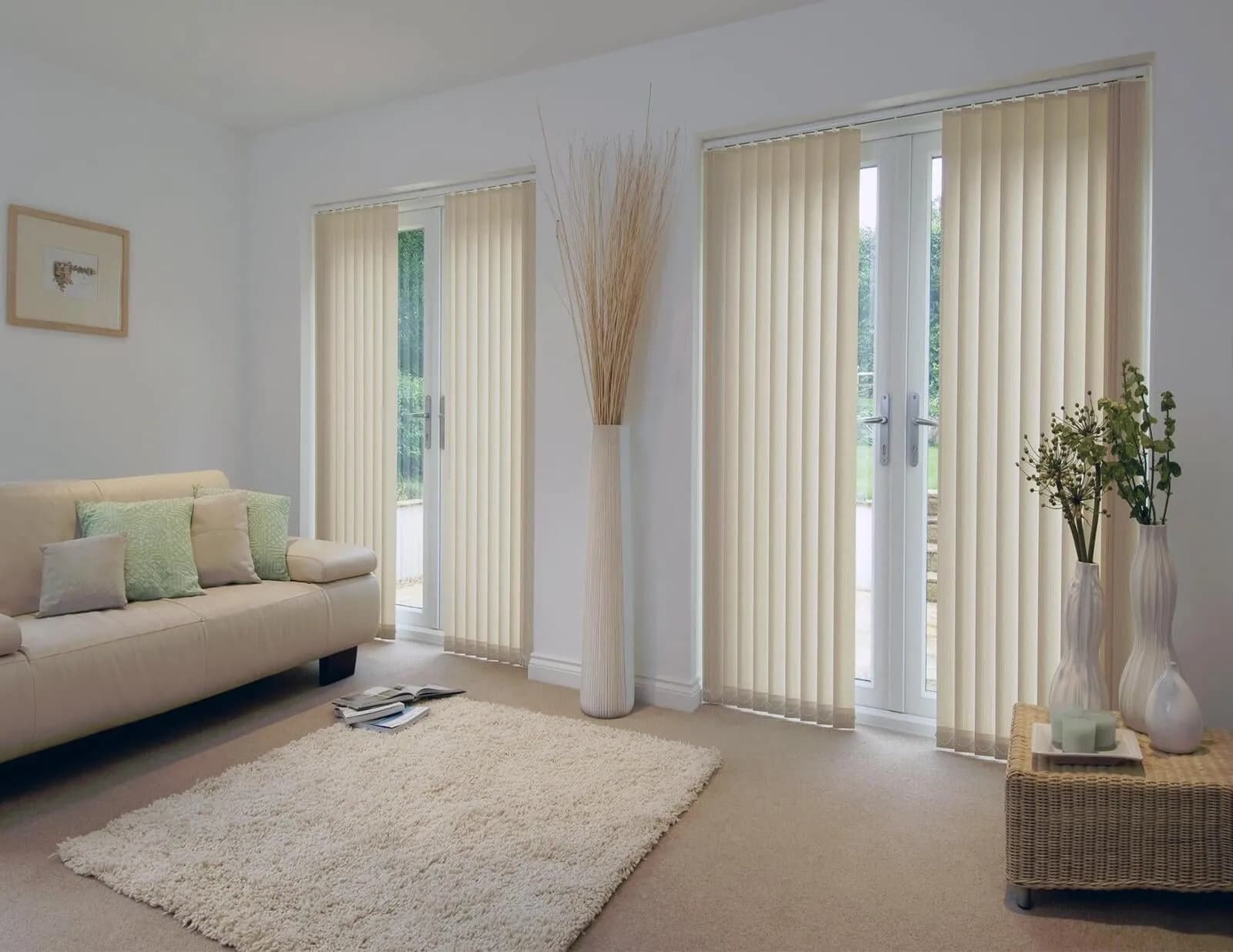 Vertical blinds drawn across French doors and a tall side window in a living room
